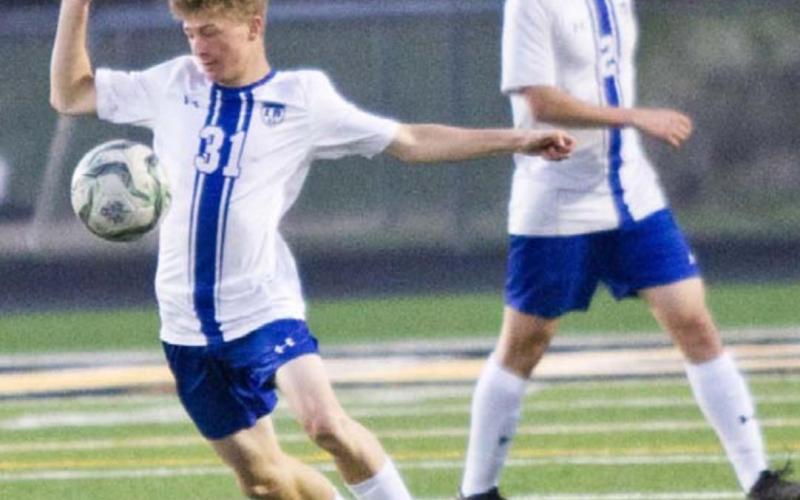 Isaac Abken (31) traps the ball in the Badgers’ bi-district match. JEFF LOWE | DISPATCH RECORD