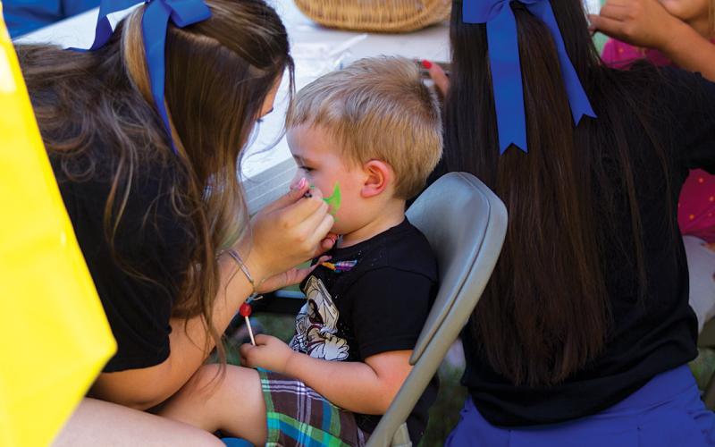 Face painting was a popular station for youngsters at the Methodist church’s Fall Festival. hunter king | dispatch record