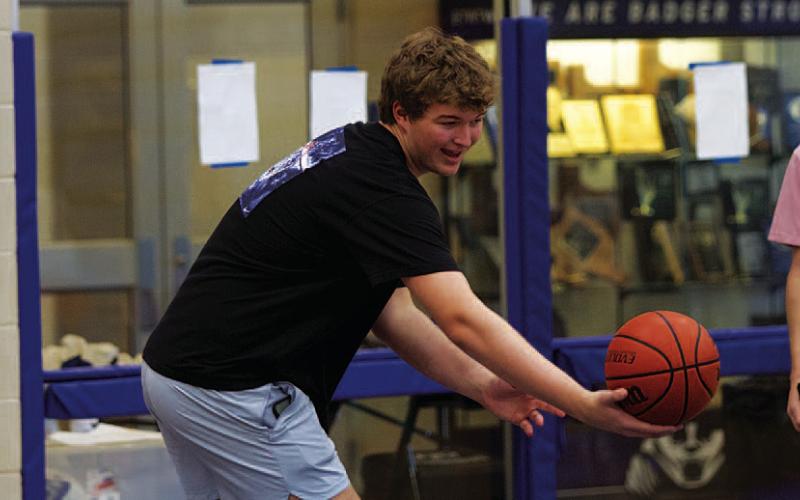 Beau Patterson, left, and Jax Pratus were some of the Badgers who helped out at camps. HUNTER KING | DISPATCH RECORD