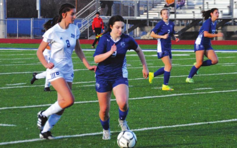 Bella Lindsey dribbles past a Jarrell defender down the right wing during the Lady Badgers’ win on Tuesday. HUNTER KING | DISPATCH RECORD