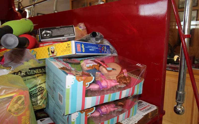 Local fire departments are doing all they can to help provide a merry Christmas for children in need, although toy donations are down about 50% from this time last year, officials said. Joycesarah McCabe | Dispatch Record