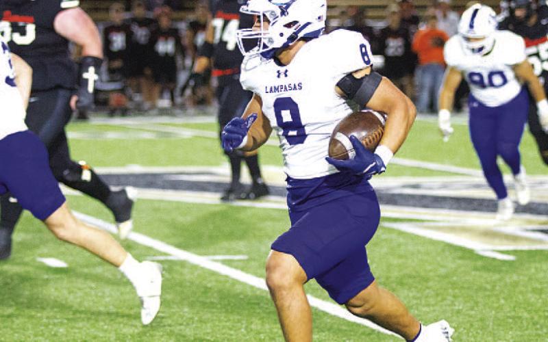 HUNTER KING | DISPATCH RECORD Eli Calderon returns his interception against the Demons in the second round of the playoffs.