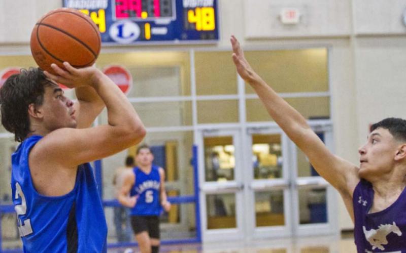 Tak Stinnett shoots from the perimeter against Marble Falls on Thursday. JEFF LOWE | DISPATCH RECORD