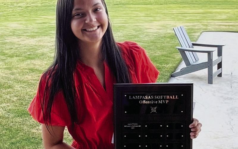 COURTESY PHOTO Madison Magilke poses with the Offensive MVP award for the softball season.