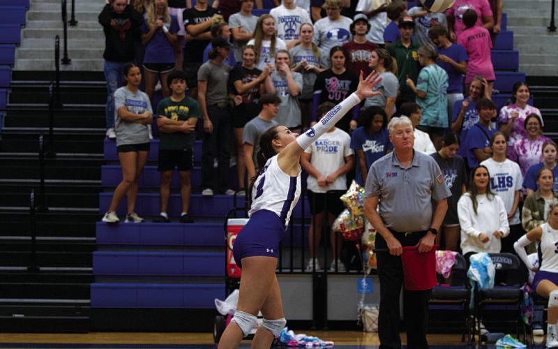HUNTER KING | DISPATCH RECORD Landry White sends a serve over the net during the match against Gateway.