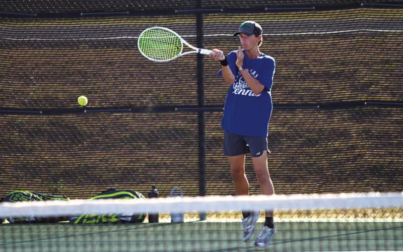 Tyler Ecker plays a shot during his doubles match against Gatesville earlier this week. HUNTER KING | DISPATCH RECORD