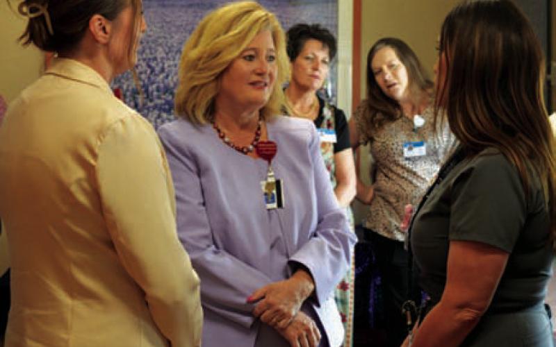 AdventHealth Central Texas President/CEO Jennifer Swenson, center, visits with local residents during Thursday’s open house at Rollins Brook hospital. ERICK MITCHELL | DISPATCH RECORD