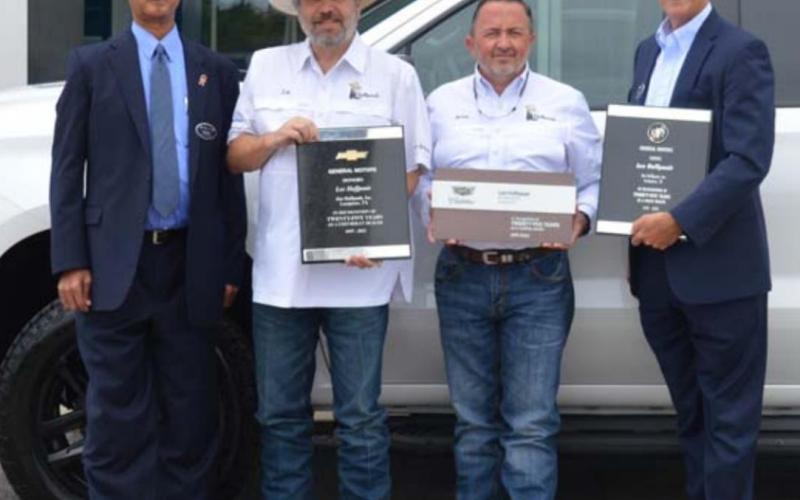 Auto dealer honored for years of service