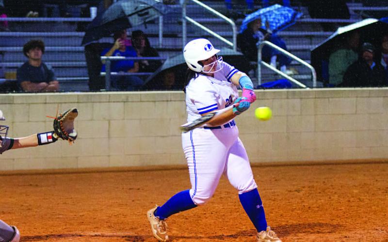 HUNTER KING | DISPATCH RECORD Amari Munoz hits a line drive to right center field late in Thursday’s contest.