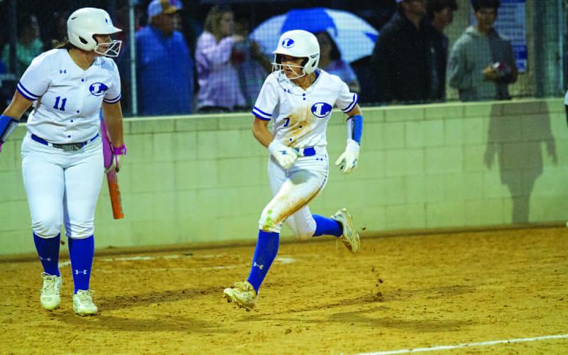 HUNTER KING | DISPATCH RECORD Maylee Kates races home for one of the Lady Badgers’ runs against Gateway.