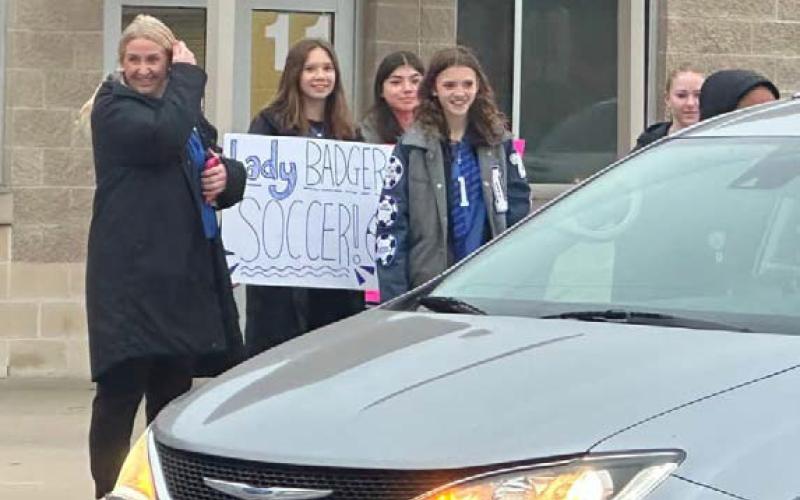 The Lampasas High School Lady Badger soccer team welcomes students arriving at Taylor Creek Elementary. courtesy photo