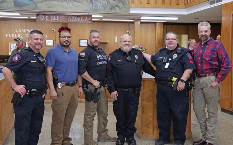 Sgt. Tony Barrio, center, was celebrated at a retirement reception for his years of service to the city. With the officer are, from left, Patrol Lt. Chuck Montgomery, Sgt. Investigator Fidel Morua, Coryell County Constable Guy Bevridge, Lampasas Police Sgt. Steve Sheldon and Police Chief Jody Cummings joycesarah mccabe | dispatch record