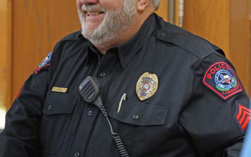 Sgt. Tony Barrio smiles as he speaks with friends and fellow officers at his retirement party Wednesday afternoon. Barrios spent more than 20 years serving the Lampasas community as a law enforcement officer. joycesarah mccabe | dispatch record