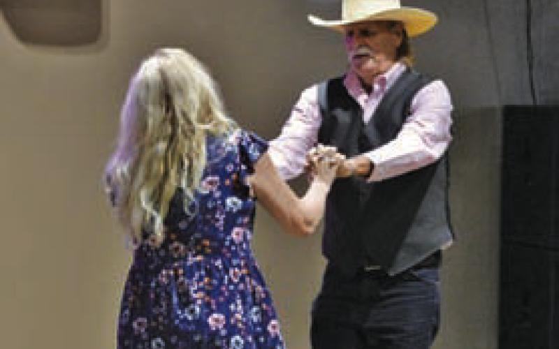 ERICK MITCHELL | DISPATCH RECORD Michael Hutchison dances with his partner Gayle Crouch during last week’s contest at Putters &amp;amp; Gutters.
