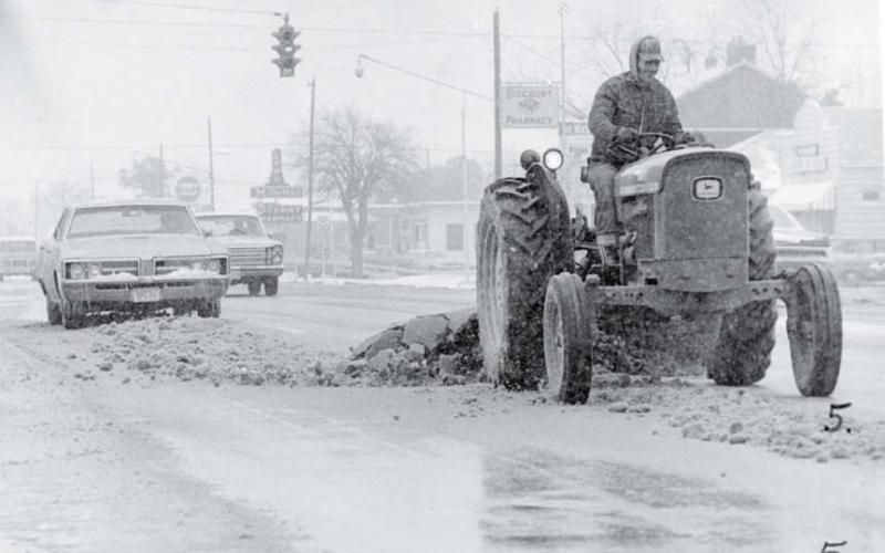 The Lampasas version of a snowplow was utilized to clear the main drag so highway and local traffic could use the roadway. lampasas dispatch photo | january 1973