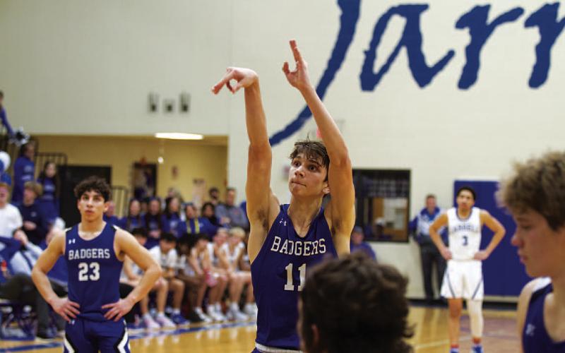 HUNTER KING | DISPATCH RECORD Luke Shivers releases a free throw for one of his 10 points in Tuesday’s game.