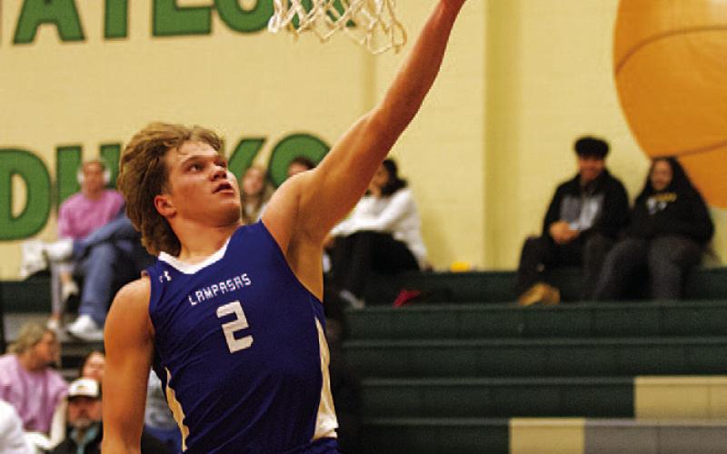 HUNTER KING | DISPATCH RECORD Haegan Oncken lays the ball up during the second half against Taylor.