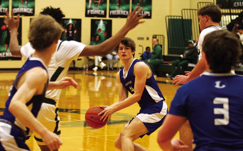 HUNTER KING | DISPATCH RECORD Calum Mitchell looks for a teammate to pass to through the Ducks’ defense.