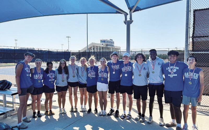 COURTESY PHOTO | KENNETH PEISER The tennis team poses for a photo after competing last Friday.