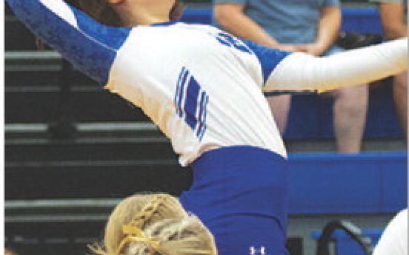 Mikayla Winter jumps to swing through a kill. HUNTER KING | DISPATCH RECORD