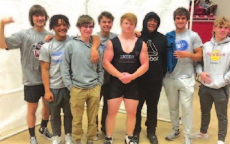 The powerlifting team poses together after competing at the regional meet last week. COURTESY PHOTO
