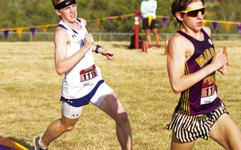 Brayden Phillips takes off from near the starting point of the district meet. HUNTER KING | DISPATCH RECORD