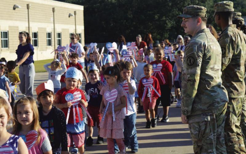 Students at Taylor Creek Elementary show their love for country and patriotic colors at a commemorative parade and assembly last Thursday morning. For more on the event that recognized the 24th anniversary of the 9/11 attacks on the nation, see page 2. ERICK MITCHELL | DISPATCH RECORD