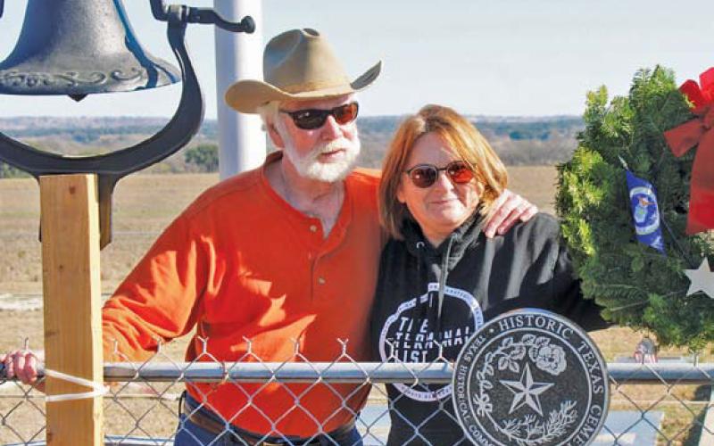 Greg Smith and Tish Casbeer stand behind the newly installed Historical Texas Cemetery medallion that honors Smith Cemetery at School Creek. Smith is the great-great-grandson of Philip Smith who initiated the cemetery in 1854. courtesy photo