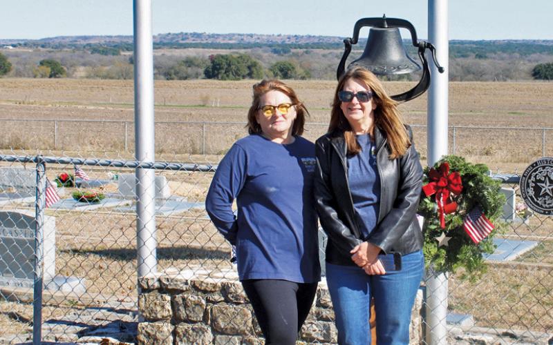 Tish Casbeer, at left, stands with her sister Mary Arnold at Smith Cemetery at School Creek. Casbeer serves as the local Wreaths Across America coordinator. Arnold is co-coordinator and also treasurer for the Smith Cemetery Association. Courtesy photo