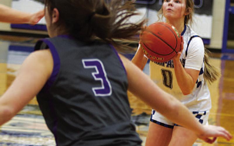 Addison Borchardt shoots one of her three-point shots. She hit two big ones in the win over Marble Falls. HUNTER KING | DISPATCH RECORD