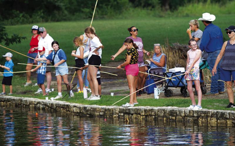 Lampasas youth show up in numbers for the opportunity to catch some fish in the park. FILE PHOTO
