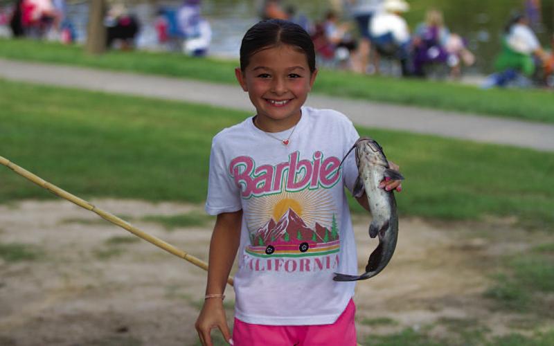 FILE PHOTO Logan Sellers caught this catfish during a fishing event last summer.
