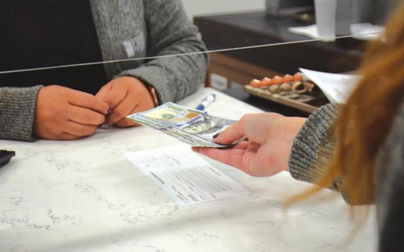 With the federal student loans on pause for the beginning part of 2022, experts say it’s time to save money. FILE PHOTO
