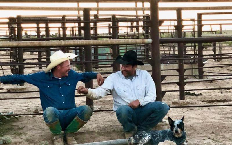 Joby Morris, left, and Jess McCabe -- whose families have been in farming and ranching for threeplus generations -- talk after a full day of working cattle on horseback. Social connections and having another person who understands the isolation, pressures to produce and financial stressors faced in agriculture is invaluable. Joycesarah McCabe | Dispatch Record