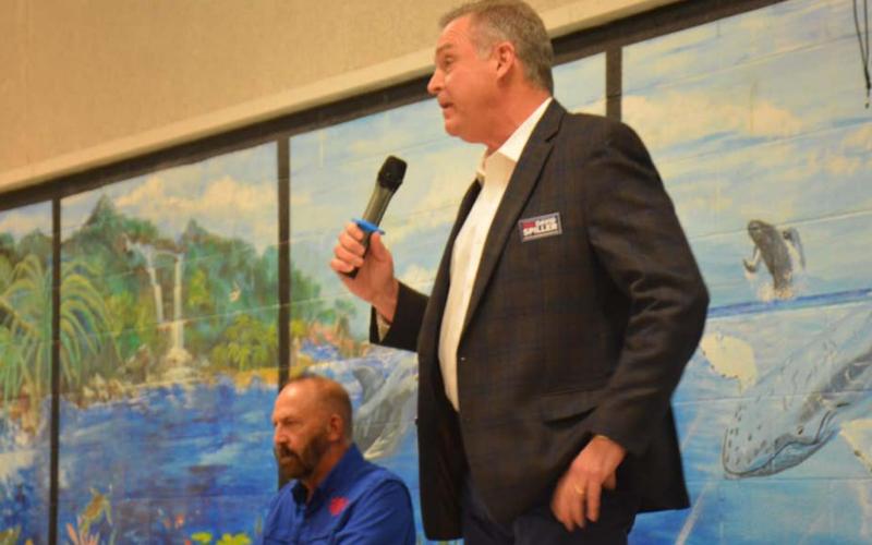 Texas House District 68 incumbent David Spiller, standing, introduces himself to an audience of about 65 at the Republican forum held Jan. 18 at the old middle school cafeteria near downtown. Seated is challenger Gary W. Franklin. MONIQUE BRAND | DISPATCH RECORD