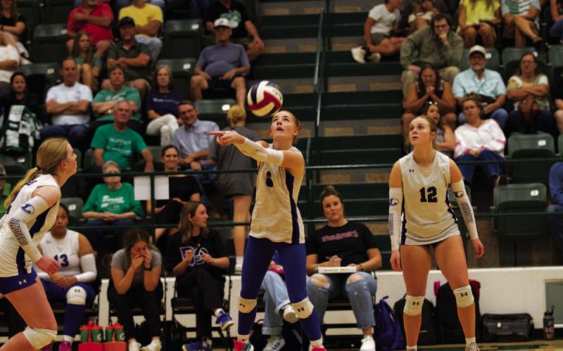 Caitlyn Bengsch plays a pass during the match against Burnet. HUNTER KING | DISPATCH RECORD