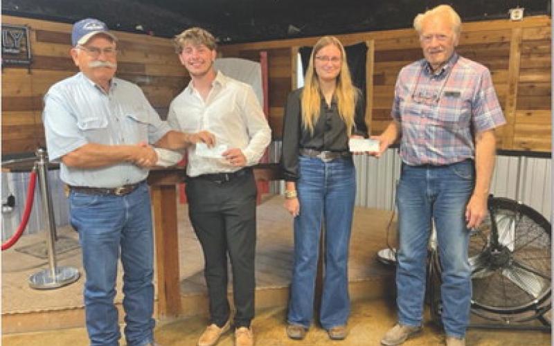 courtesy photo Lampasas Pilots Association offered its first scholarship awards at a recent meeting. Pictured, left to right, are pilots association member Rusty Knox, scholarship co-recipients Koh Stapp and Delanie Smith, and pilots association member Gordon Thornton.