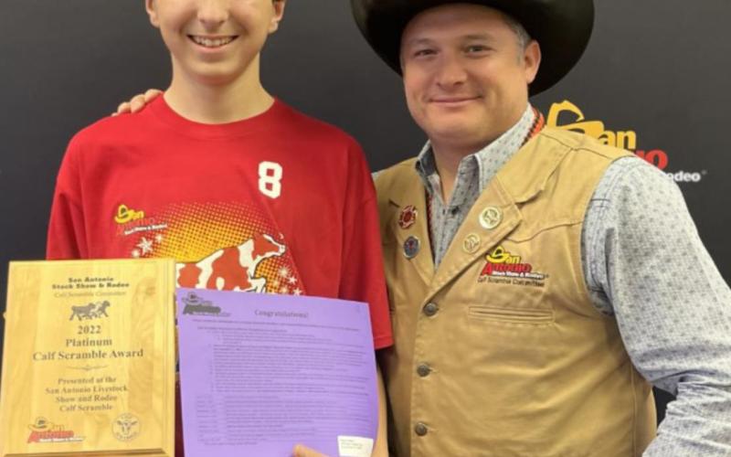 Student earns money in calf scramble