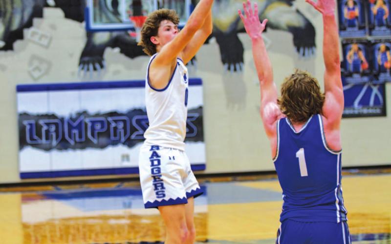Nate Borchardt shoots over a Whitney defender in the Badgers’ home game last month. HUNTER KING | DISPATCH RECORD
