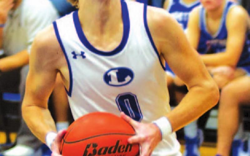 Nate Borchardt goes to the basket for a layup against Whitney. In the game, he scored his 1,500th career point. HUNTER KING | DISPATCH RECORD