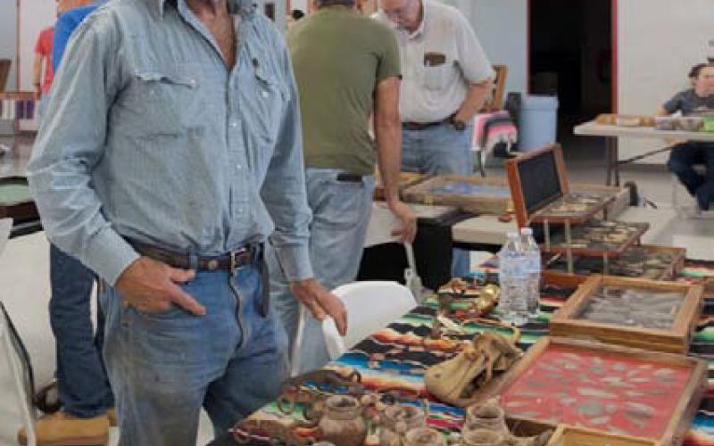 Jim Kolz views Native American artifacts and arrowheads on display. GABRIELA SANGACHE |DISPATCH RECORD