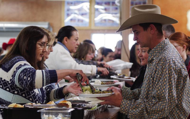 ADAM BARRIOS | DISPATCH RECORD Before the premium sale, attendees were served a steak dinner during Saturday evening’s activities.