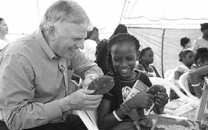 Franklin Graham, at left, is president of Samaritan’s Purse, the sponsoring organization of Operation Christmas Child. The project collects shoebox gifts and delivers them to children in need to demonstrate God’s love in a tangible way. SAMARITAN’S PURSE | COURTESY PHOTO