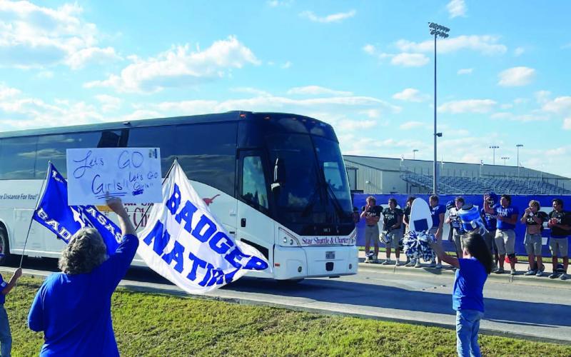 Members of the community and the Badger football team send off the volleyball team to Liberty Hill for their playoff game.