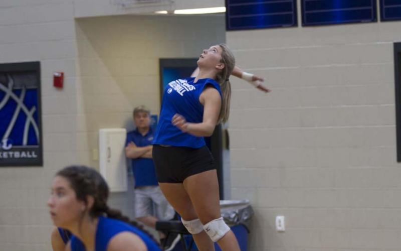 Madison Roedler goes up for a serve during the scrimmage on Friday in Lampasas. HUNTER KING | DISPATCH RECORD