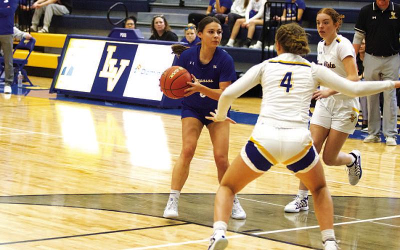 HUNTER KING | DISPATCH RECORD Chloe Thorp looks for a teammate to pass to during Tuesday’s game against Lago Vista.