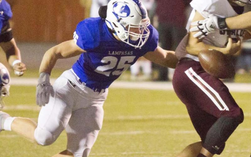 Badger linebacker Keagan Richardson (25) helps cause a fumble that Josh Carter returned for his first varsity touchdown on Thursday. The Badgers earned their third consecutive bi-district title. JEFF LOWE | DISPATCH RECORD