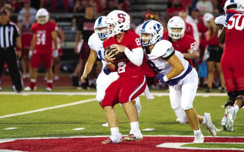 HUNTER KING | DISPATCH RECORD Brady Renfrew wraps up the Salado quarterback during last week’s game.