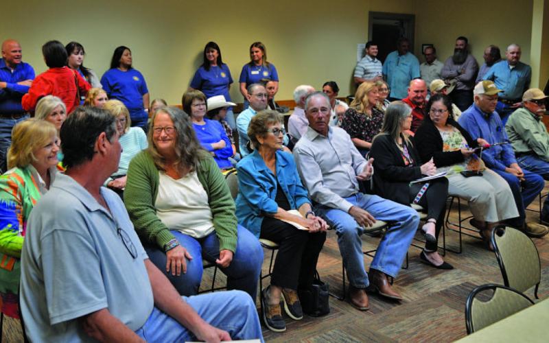 Several dozen residents attended Monday’s Lampasas County Commissioners Court meeting to protest a private railway reconstruction project that would slice through Burnet and Lampasas counties. ERICK MITCHELL | DISPATCH RECORD