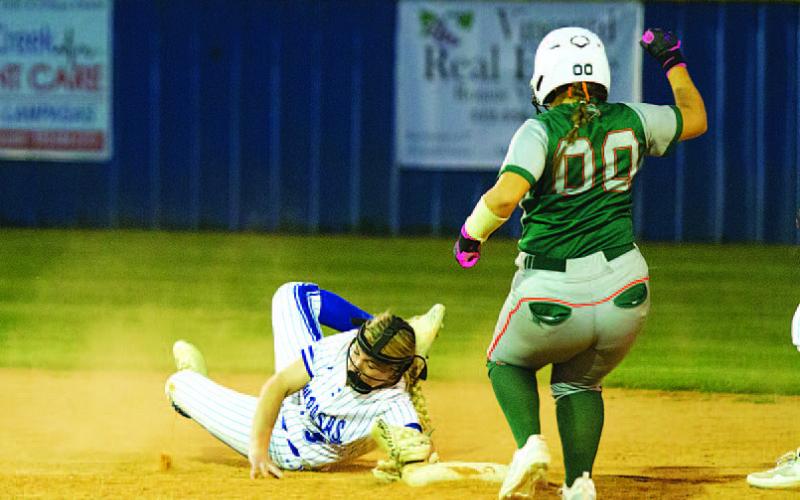 HUNTER KING | DISPATCH RECORD Brady Burton dives to touch second base to record an out in Tuesday’s contest.